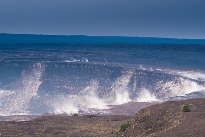 a man riding a wave on top of a mountain